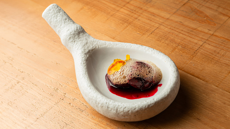 Dessert with cherries and foam