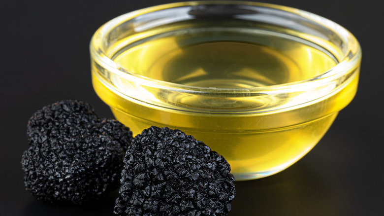 Truffles and truffle oil in a glass bowl