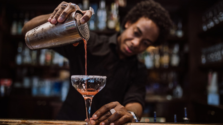 man mixing a cocktail