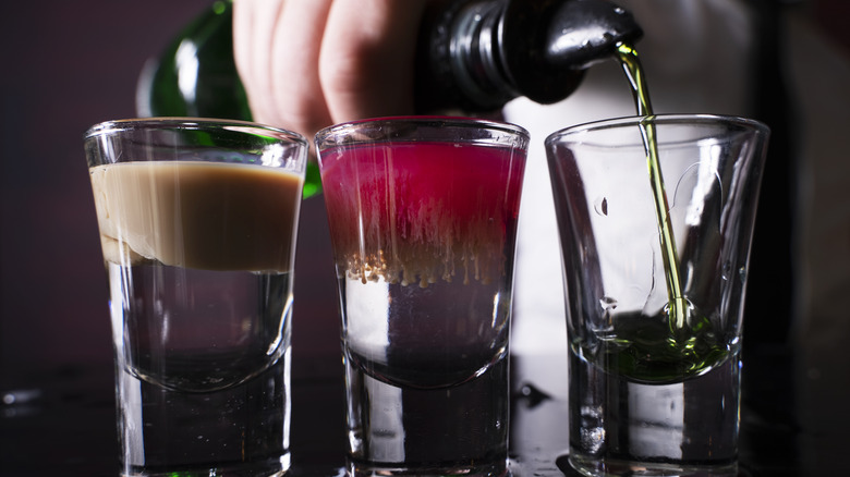pouring liquor into shot glass