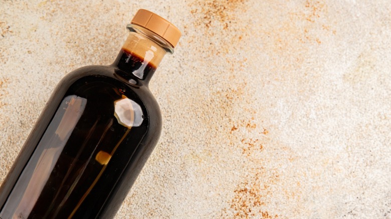bottle of balsamic vinegar on beige background