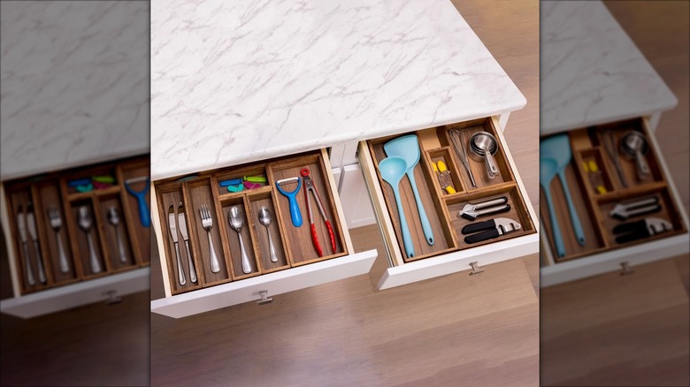 wooden organizers in kitchen drawers