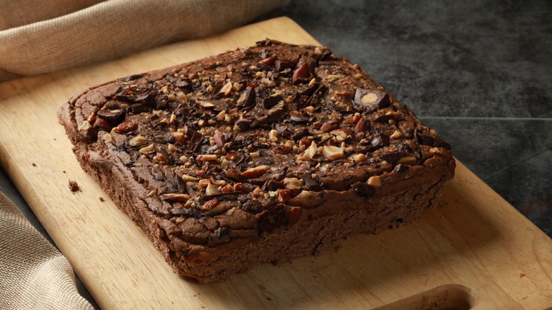 bean brownies with nuts on wooden board