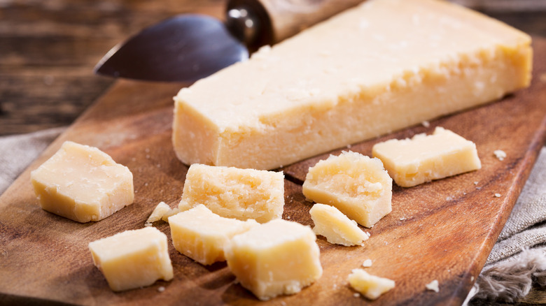 Parmesan cheese on a wooden board