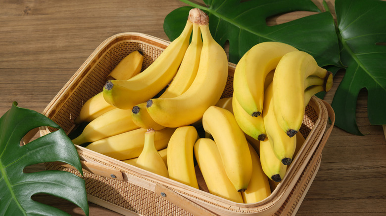 A small wicker basket filled with bananas