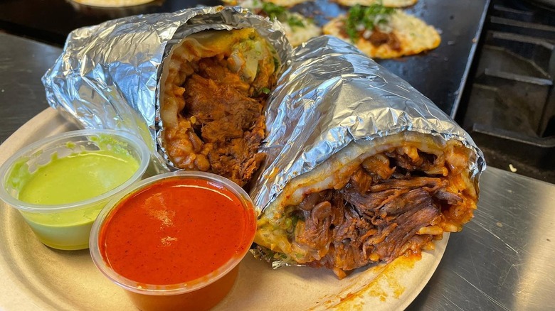 A birria taco cut in half