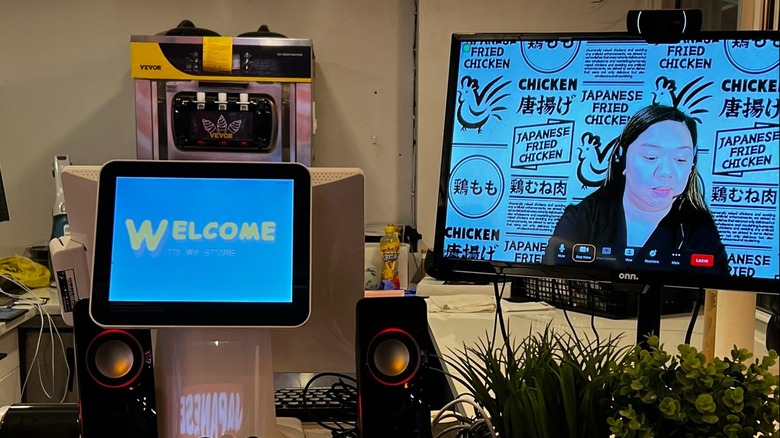 Cashier on a Zoom call at Sansan Chicken in NYC