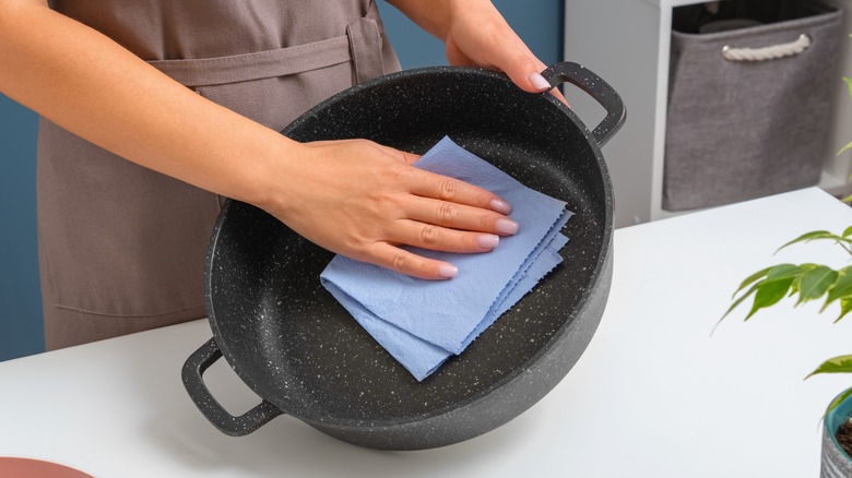 cast iron pan and blue paper towel