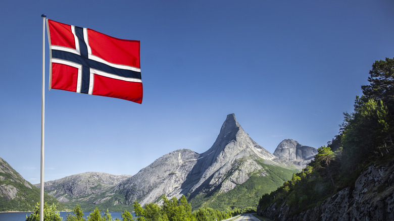 Road in Norway with Norwegian flag flying