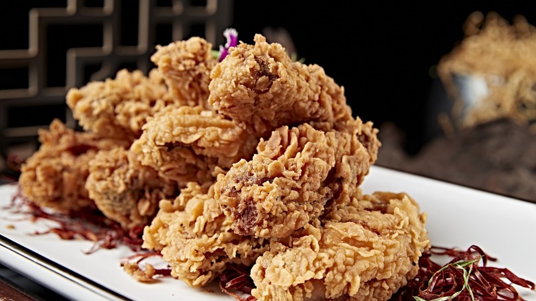 fried chicken piled high on platter