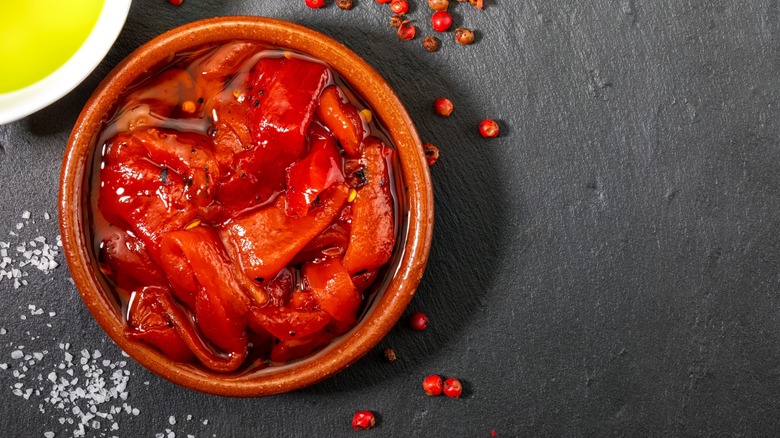 roasted red peppers in liquid with spices