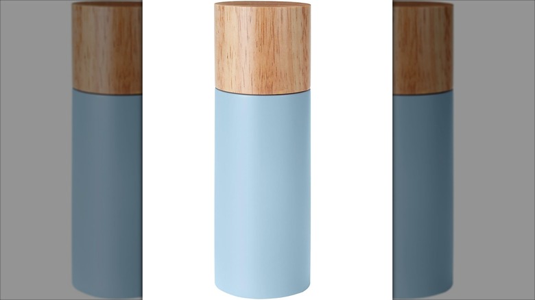 blue spice grinder with wooden cap