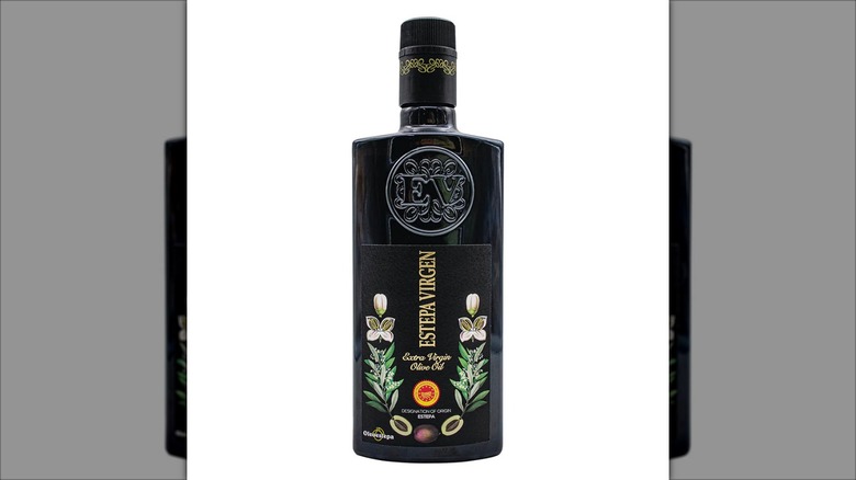 black bottle of EVOO with decorations