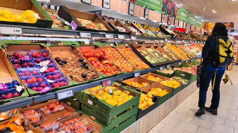 Woman looking at produce at Lidl in Ireland
