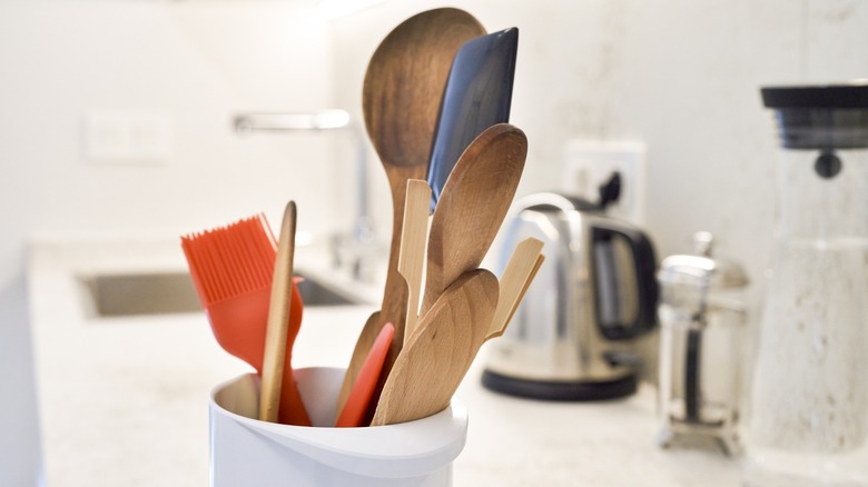 kitchen tools in container on countertop