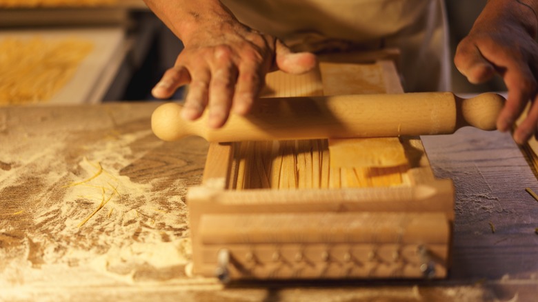 person hand making pasta