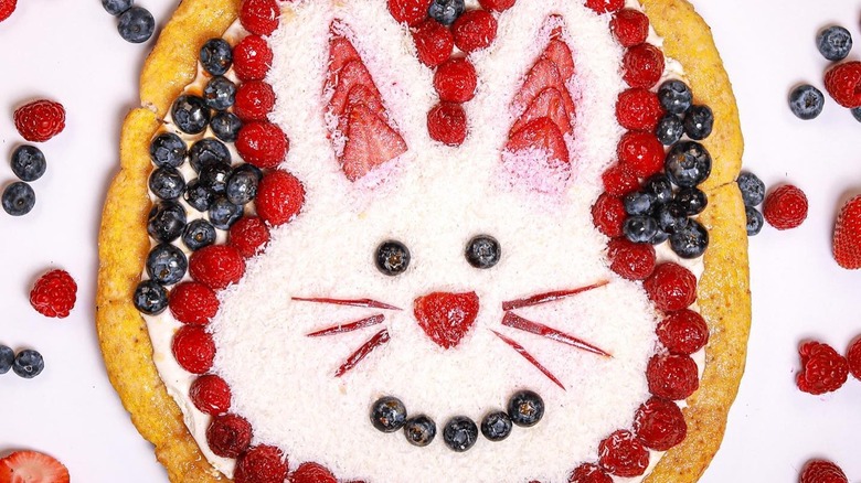 fruit pizza in the shape of an easter bunny