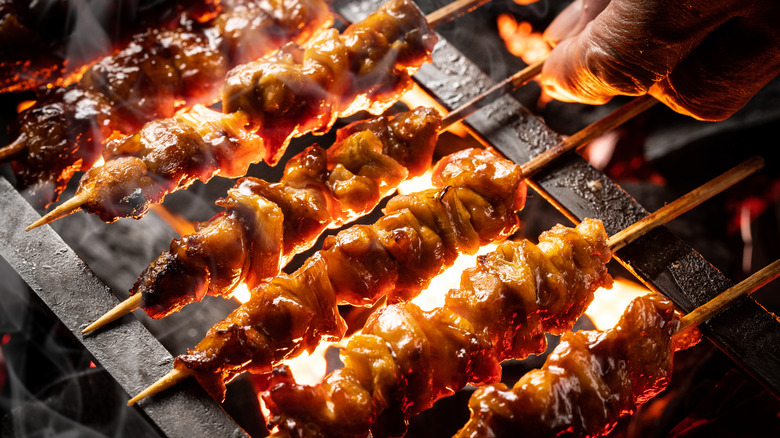 Yakitori cooking over a grill