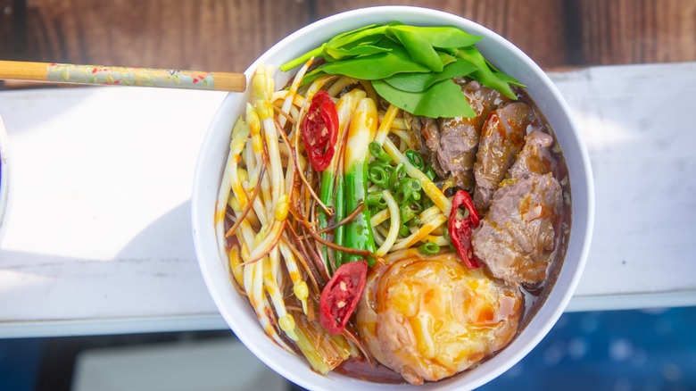 bowl of vietnamese bun bo hue with lots of toppings