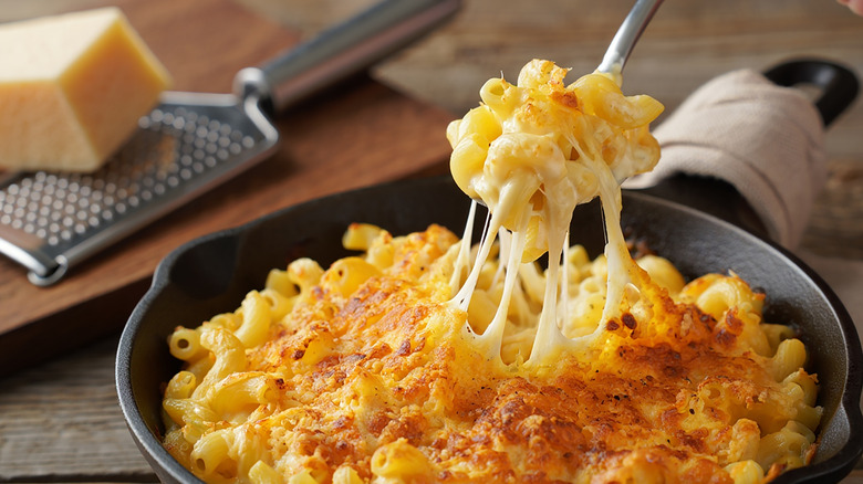 baked mac and cheese with spoon