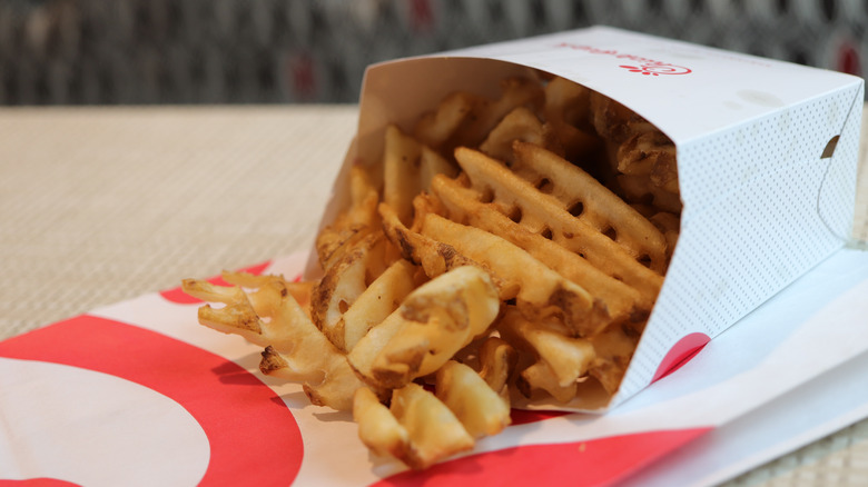 Chick-fil-a waffle fries in paper container, closeup