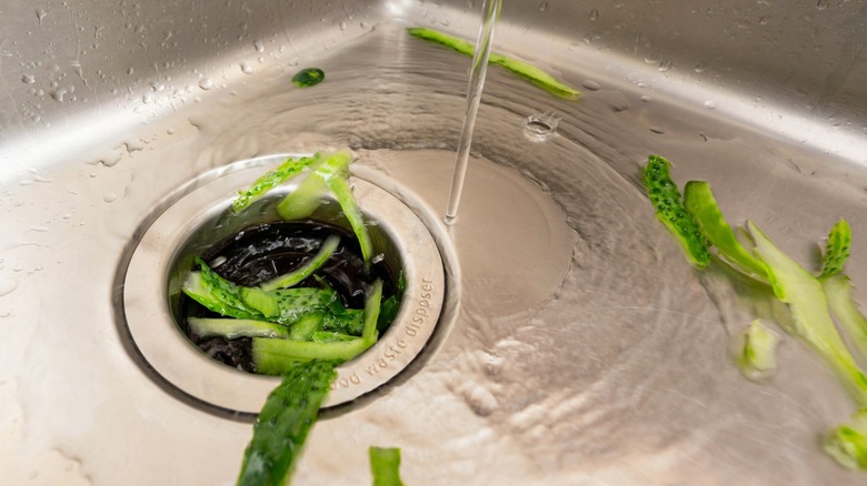 washing kitchen scraps down garbage disposal