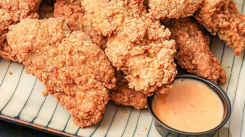 Chicken from Atlas Monroe with dipping sauce on the side