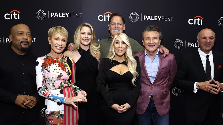 Cast of "Shark Tank" posing for photos