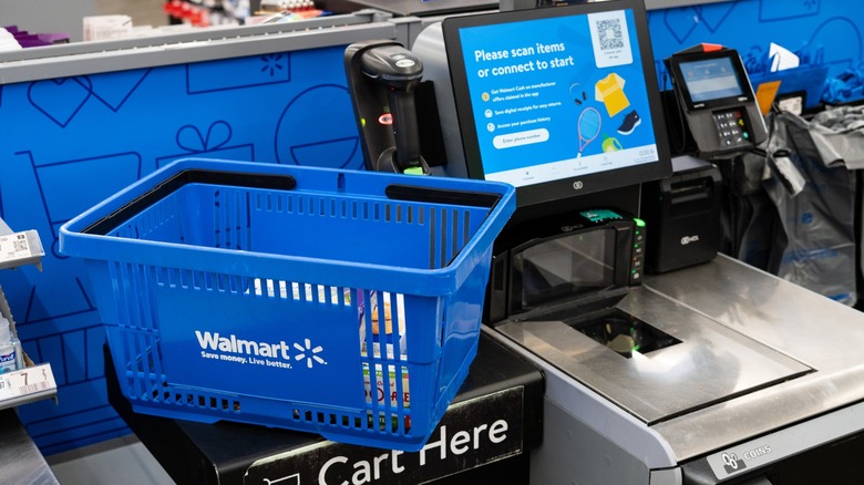 blue walmart shopping basket at self-checkout stand