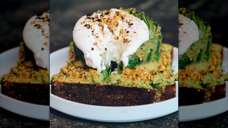 A poached egg atop avocado toast