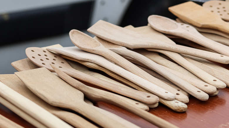 An array of wooden cooking utensils