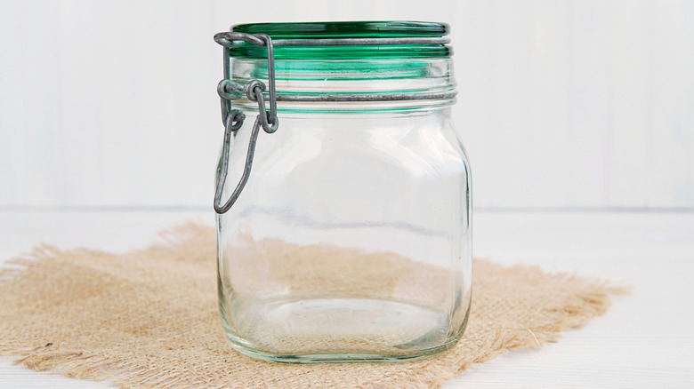 An empty glass mason jar