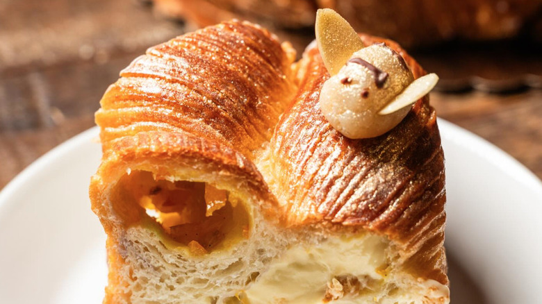 Slice of King Cake with decorate edible bee