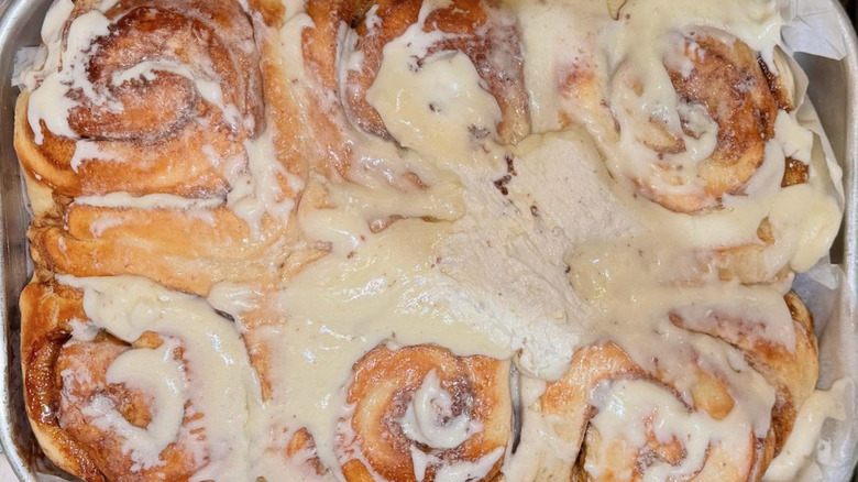 Pan of fresh baked and iced cinnamon rolls