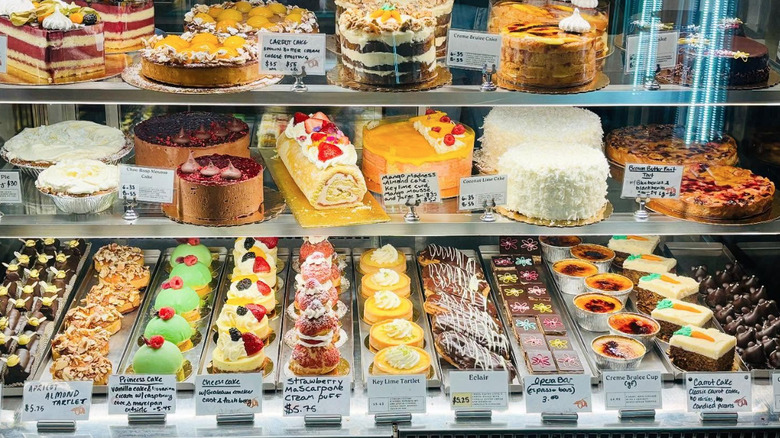 Stocked bakery case with different cakes