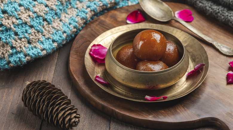 Gulab jamun in a copper bowl