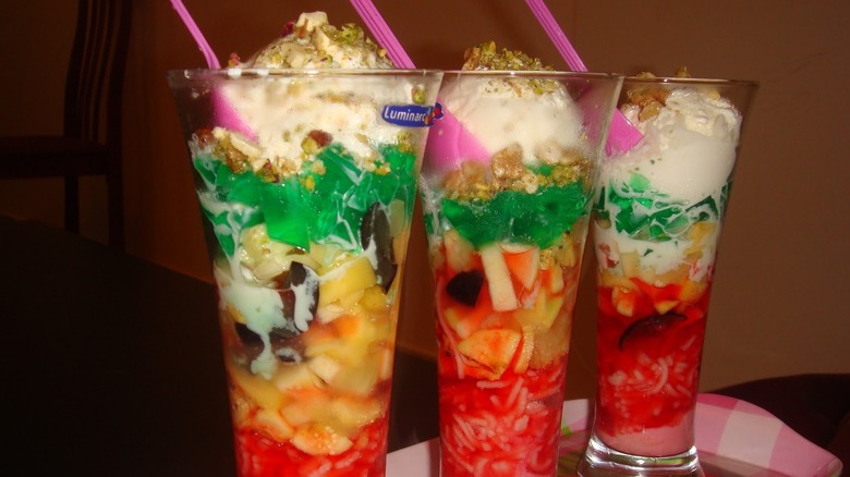 Three falooda with pink spoons