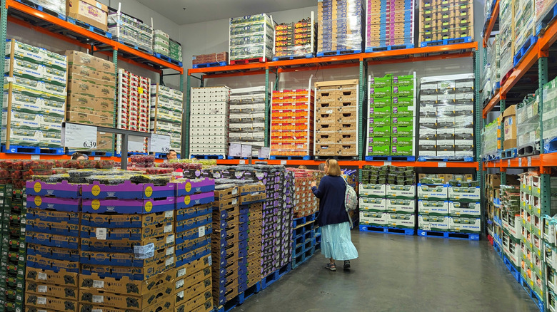 Shopper in Costco's refrigerated fruit section