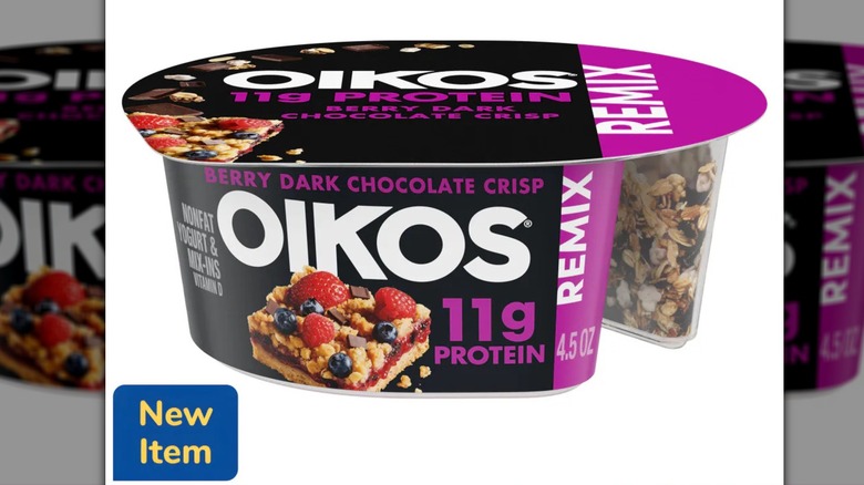 A container of Oikos Mixed Berry High Protein Mixin Nonfat Greek Yogurt