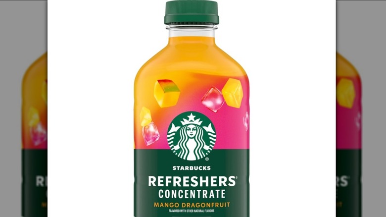 A bottle of Starbucks Refreshers Concentrate Mango Dragonfruit Refreshing Drink Cold Drinks