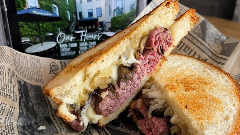 Sandwich featuring Boar's Head roast beef slices, closeup