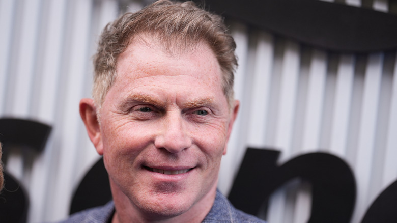 bobby flay smiling on the red carpet