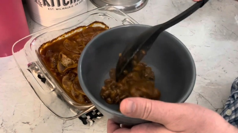 apple bean bake is served from a casserole dish