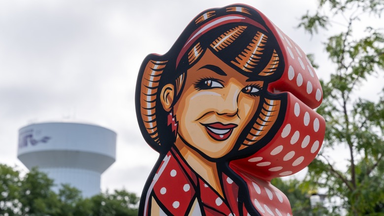 betty crocker statue outdoors with red polka dots
