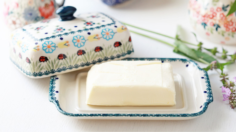 A ceramic butter dish on a table