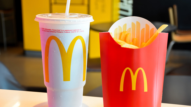 mcdonald's coke and fries side-by-side on table