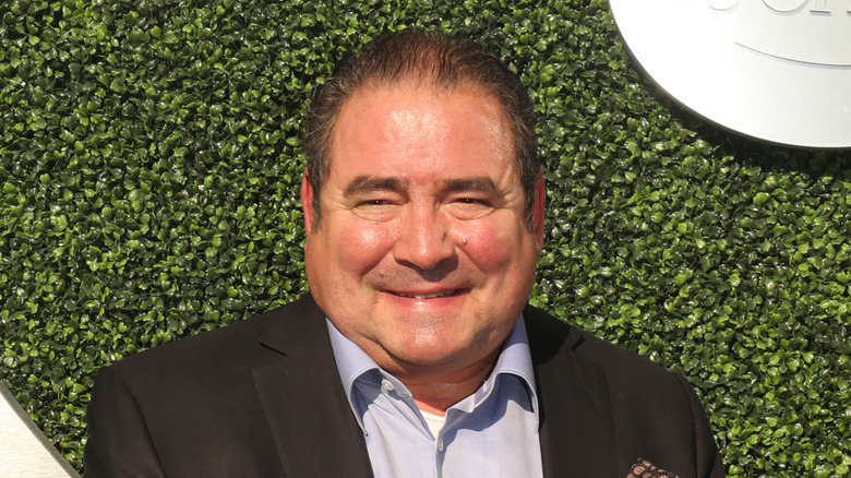 A close-up of Emeril Lagasse smiling.