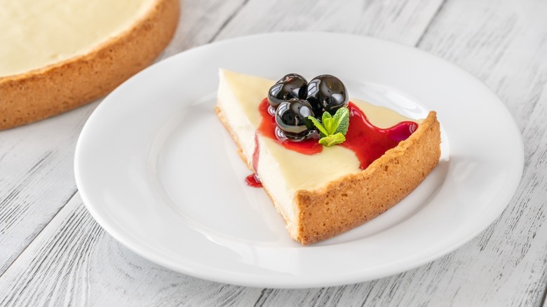 chicago style cheesecake with cherries and syrup