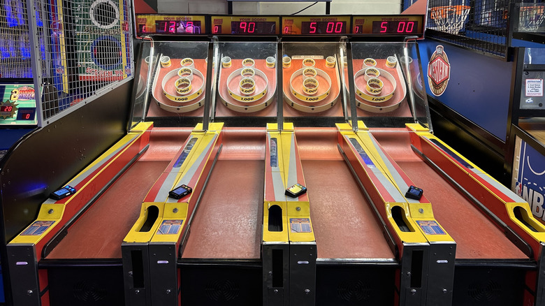 Interior of a Chuck E. Cheese with skeeball games.