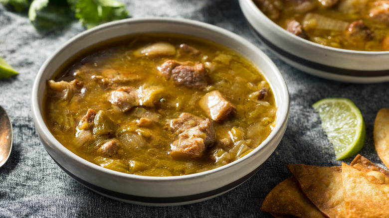 Colorado green chili with chips and lime